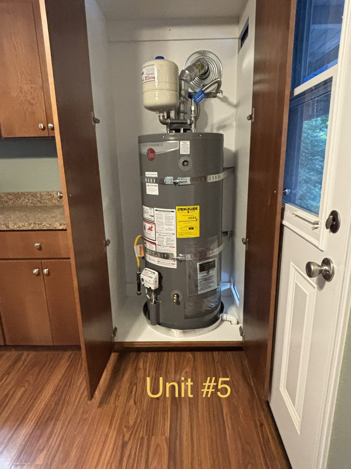 New tank water heater installed in closet